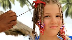 Here are three classic low maintenance protective styles to keep your hands out of your hair during your beach vacation trip: A Cute 9 Year Old Girl Gets Stock Video 100 Royaltyfri 6972352 Shutterstock