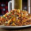 Build nachos with all ingredients. 3
