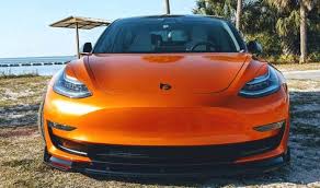 This Orange Wrapped Tesla Model 3 Looks Alluring In 2020 Tesla Model Tesla Tesla Car