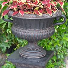 We manufacture over 200 cast stone planters & urns in a wide variety of shapes and sizes. 24 In X 18 In Cast Stone Urn With Handles In Aged Charcoal Pf6653ac Mpg Planters