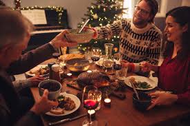 Christmas eve can also be celebrated with colleagues in the office for the special dinner together. Family Having A Christmas Eve Dinner Together Jacob Lund Photography Store Premium Stock Photo