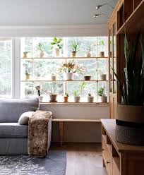 This elegant contraption by a beautiful mess offers a ton of flexibility, allowing you to swap out plants or easily take plants cara of never skip brunch was inspired by a $198 anthropogolie hanging planter when creating this diy. Hanging Plant Shelves The Artful Roost