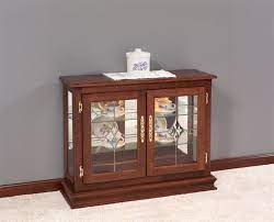 A curio cabinet is a display case meant to showcase decor, collectables or other intriguing items. Great Deals On Console Curio Cabinets Gardens Nursery