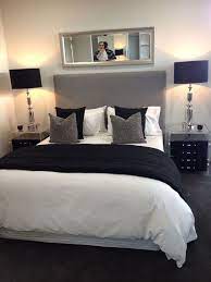 Having a headboard like this, not the same color necessarily that takes up most of the wall with a black stone on the wall behind it. White Is The Perfect Shade Of Bedroom Design For Every Occasion It Is Symbolizing Peace And Purit Gray Master Bedroom Master Bedroom Interior Bedroom Interior
