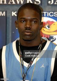 Mark Jelks and coach Al Hobson at the 80th Kansas Relays Gold Zone... News  Photo