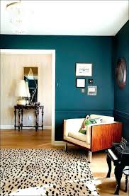 Crafty orange living room with orange walls, cozy orange sofa, chic upholstered orange armchairs, a fireplace, and antique decor pieces. Inspirational Living Room Ideas Living Room Design Dark Orange Living Room Ideas