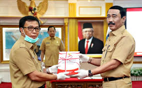 The minister administers the portfolio through the ministry of home affairs. Ditjen Bina Pembangunan Daerah