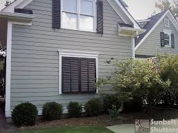 The slats are louvered to allow in light, and the shutter doors are hinged to provide easy access to the window. Garage Makeover Faux Window Bahamas Shutters Shutters Exterior Lake Houses Exterior Louvered Shutters