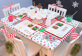 Instead of decorating sugar cookies, make your holiday party a house party, as in gingerbread house party. Christmas Cookie Decorating Party Chinet