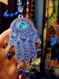 Image result for History of the evil eye ,Greek. Karma & luck.The evil eye is one of the strongest symbolic images in the world. Angels on top, songs to sing, love and luck to share, ups and downs, lessons learned, moving on. More mountains to climb.