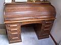It might be a good idea to splurge for the adjustable height desk. Rolltop Desk Wikipedia