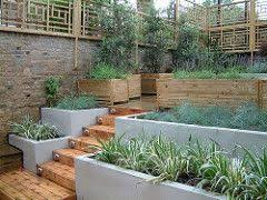Oriental Trellis In A Modern London Garden Sloped Garden Garden Stairs Modern Garden Trellis
