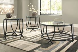 Simple, yet unique in its own way, this set's tables have angular bases that support elm veneer tops full of textural beauty. The Tarrin Black Occasional Table Set 3 Cn Available At Riley S Rooms Serving Tecumseh And Windsor Ontario
