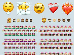 A yellow face with smiling eyes, a closed smile, rosy cheeks, and several hearts floating around its head. New Emoji For 2021 Face Exhaling Beards Heart On Fire
