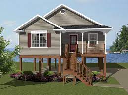 Plans for houses on stilts have a grid system of girders (beams), piers, and footings to elevate the structure of the home above the ground plane or grade. Lilburn Bay Coastal Beach Home Plan 069d 0108 House Plans And More