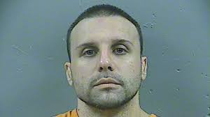 Man accused of pawn shop killings gets life after escape attempt