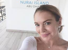 Confessions cross dangle earrings jewelry: They Take It Seriously Lindsay Lohan Explains Dubai S Coronavirus Rules To David Spade The National