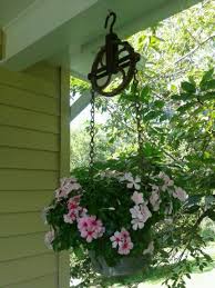 Bird Feeder Pulley System Picked An Old Well And Chain Pulley System And Created A Hanging Planter Garden Projects Hanging Planters Lawn Garden