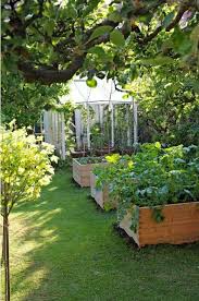These Wooden Raised Beds Are Built Higher Up So You Don T Need To Bend Down To Maintain Them Fenced Vegetable Garden Vegetable Garden Boxes Garden Inspiration