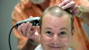 United Way donation leads to head shaving