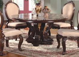 It boasts a striking mahogany finish and is set on four sturdy wooden legs. Ornate 60 Marble Topped Round Dining Table With Antique Brown Finish Dining Room Table Marble Marble Top Dining Table Marble Dining Table Set