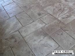 Admiring your beautiful stamped concrete patio like it's a rare piece of artwork on loan from the local museum! Stamped Decorative Concrete Patterns Nj Concrete Pattern Concrete Patio Concrete Decor