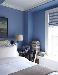 Simple accessories and a plain window shade allow the bold blue to hold court. Summery Blue And White Bedroom Christopher Maya Design Master Bedroom Interior Blue Master Bedroom Master Bedroom Interior Design