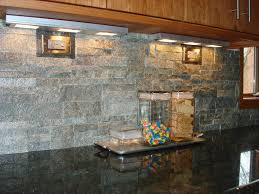 The tile features random strips of stacked stone glued together for ease of installation. Black Chevron Wall Tile Novocom Top