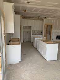 Install next cabinet and clamp one of the most important parts of learning how to hang cabinets is to have a helper to lift and support your kitchen cabinets. New Construction In Apex Raleigh Premium Cabinets