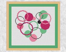 It's known as counted cross stitch because you have to count the number. Modern Heart Cross Stitch Pattern Printable Circles Heart Pdf Simple Easy Geometric Counted Cros Cross Stitch Heart Cross Stitch Patterns Simple Cross Stitch