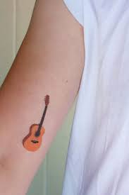 Easy to remove the only thing that tops a guitar tattoo that's easy to apply is a guitar tattoo that easy to remove! Acoustic Guitar Tattoo Bing Images Guitar Tattoo Design Guitar Tattoo Tattoos For Guys