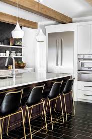 Kitchen Black And Gold Bar Stools Masculine Contemporary Kitchen Boasts Four Cb2 Roadhouse Black Leather Bar Stools Placed In Front Of A Brown Isla Home Kitchens Kitchen Interior Kitchen Design