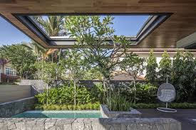 For example a large massing of ornamental grasses pops out against a grey concrete wall, orange cushions draw your eye when placed on otherwise simple patio. A Stylish Modern Semi Detached House With Remarkable Interiors In Bukit Timah 4