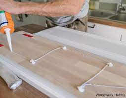I advise getting a creamic tile drill bit and drilling a hole through the tile using the guide as a template. How To Glue Wood To Tile The Right Way Woodwork Hubby