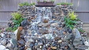 Include a heavy duty pump and stone filters to reduce the amount of maintenance needed for this large water feature. Diy Backyard Waterfall Youtube