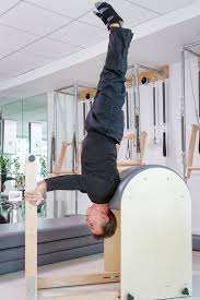 This Is Our Own Jim Buckley Doing A Shoulder Stand On The Ladder Barrel Many Issues Including Poor Posture Stiff Necks B Pilates Core Pilates Pilates Workout
