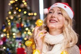 Woman of the new year with a beautiful face in a red Christm