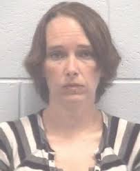 Woman accused of trying to poison co-workers