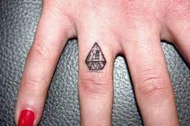 Ring tattoos often look crisp in the beginning but start to spread faster than big body tattoos, says mickey t. Illuminati Tattoos Tattoofanblog