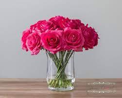 A fresh blend of colors and flowers can be found in this bold basket. Real Touch Rose Flower Arrangement Fuchsia Dark Pink Roses In Etsy Rose Flower Arrangements Pink Flower Arrangements Flower Vase Arrangements