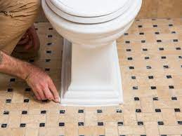 Caulking around the base can help secure your toilet to the floor. How To Replace A Toilet Diy Toilet Installation Guide Hgtv