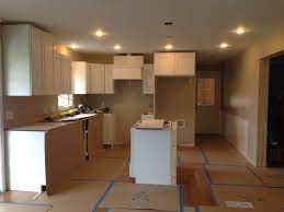 Choosing the right kitchen paint colors with oak cabinets or maple cupboards will highlight the tone of the wood, according to better homes and gardens. Wilmington Kitchen Family Room Laundry Room Cabinet Installation Remodeling Designs Inc
