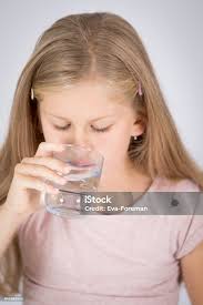 Thirsty Girl Drinking Pure Water From Glass Stock Photo