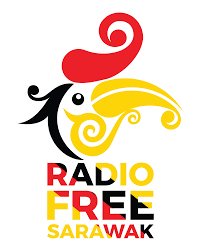 Malaysian kid with flag running. Radio Free Sarawak