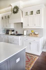 Plenty of storage space for linens. The Backsplash Is A Light Gray Subway Tile Color Is Called Pumice Made By H Line Grout Co White Kitchen Design Glass Kitchen Cabinets Kitchen Cabinets Decor