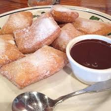(do not crowd the pan,) cook for 3 to 3 1/2 minutes, turning occasionally, until the zeppole are golden and puffed. Zeppoli