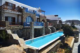 The Elegantly Appointed Premium Garden View With Sharing Pool Rooms Boast Terraces With View To A 52 Sq M Starlight Sharing Pool An Grand Hotel Mykonos Resort