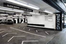 signage as backseat driver typography throughout the building directs drivers what to do and where parking design park signage signage design