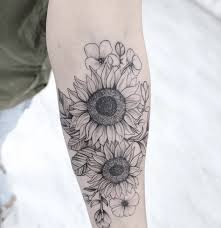 The inclusion of color and simple, curved lines also makes the tattoo realistic yet artistic. Sunflower Tattoo Black And White Small