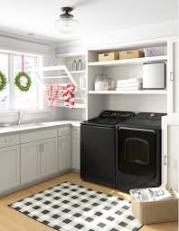 Rustic laundry room featuring a sliding barn door, gray tile floors, stainless steel appliances, white subway tiles and a classic farmhouse sink | garrison hullinger. 90 Dorm Laundry Room Design Ideas Wayfair